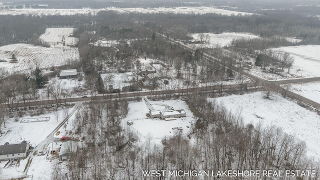 snowy aerial view with a rural view