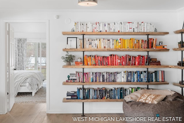 interior space with crown molding and hardwood / wood-style floors