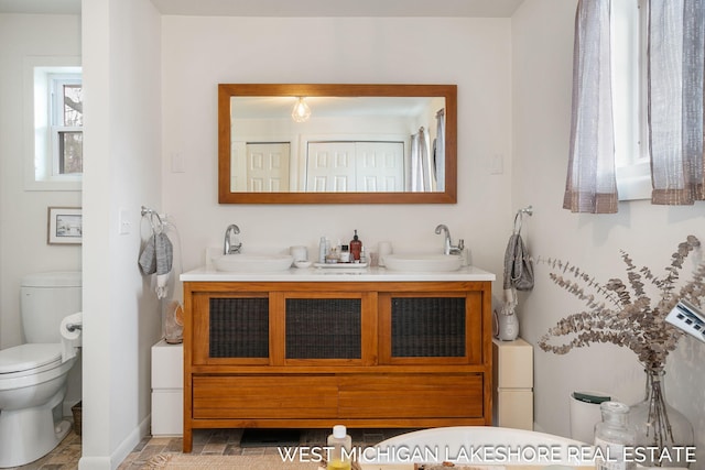 bathroom with vanity and toilet