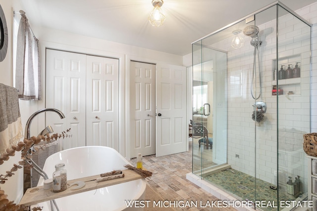 bathroom with independent shower and bath