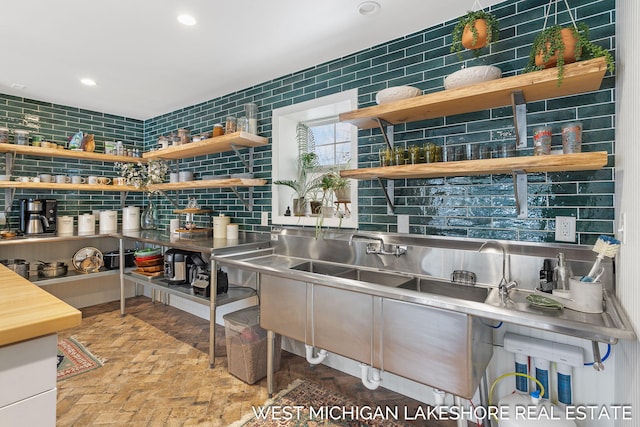 interior space with stainless steel counters and backsplash