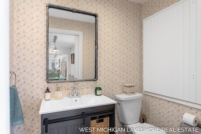 bathroom with vanity and toilet