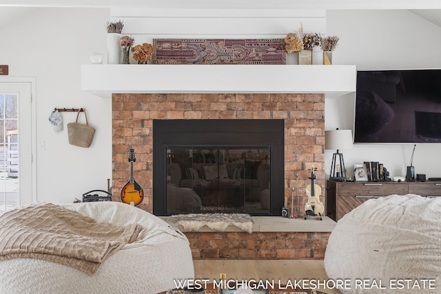 details featuring hardwood / wood-style flooring and a fireplace