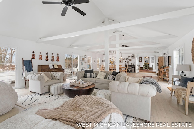 living room with beamed ceiling, high vaulted ceiling, ceiling fan, and light wood-type flooring