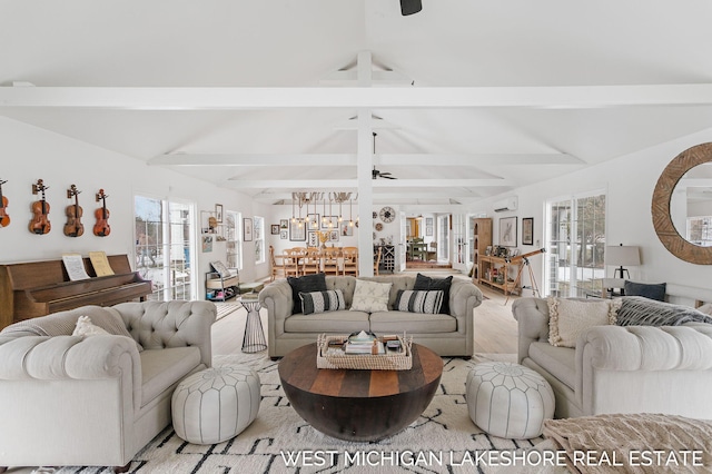 living room with lofted ceiling with beams and ceiling fan