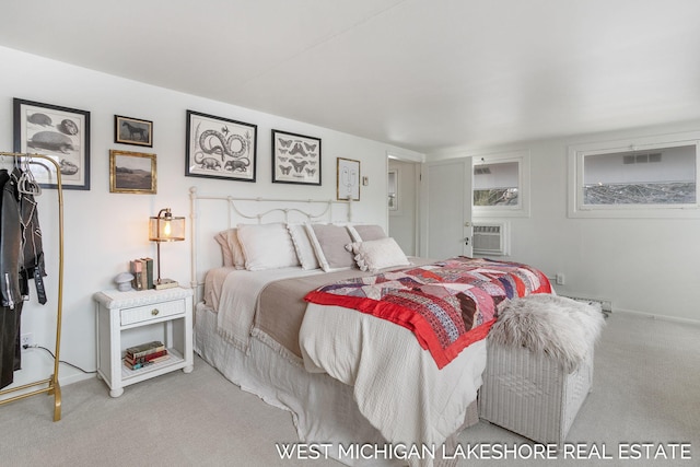 bedroom featuring a wall mounted air conditioner and carpet