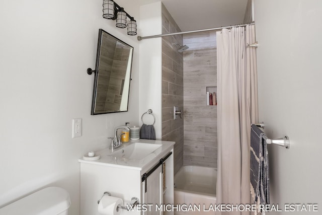 full bathroom with vanity, shower / bath combo, and toilet