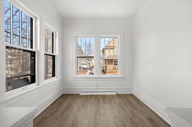 unfurnished dining area featuring a baseboard radiator and dark hardwood / wood-style floors