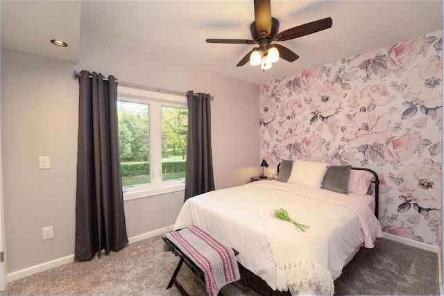 bedroom featuring light carpet and ceiling fan