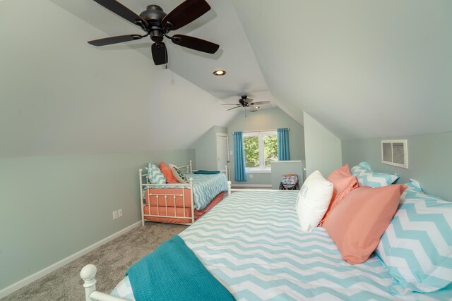 bedroom with vaulted ceiling, ceiling fan, and carpet floors