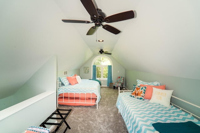 carpeted bedroom featuring lofted ceiling and ceiling fan