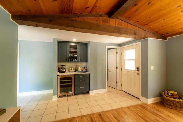 bar featuring light tile patterned floors, wood ceiling, vaulted ceiling with beams, tasteful backsplash, and beverage cooler