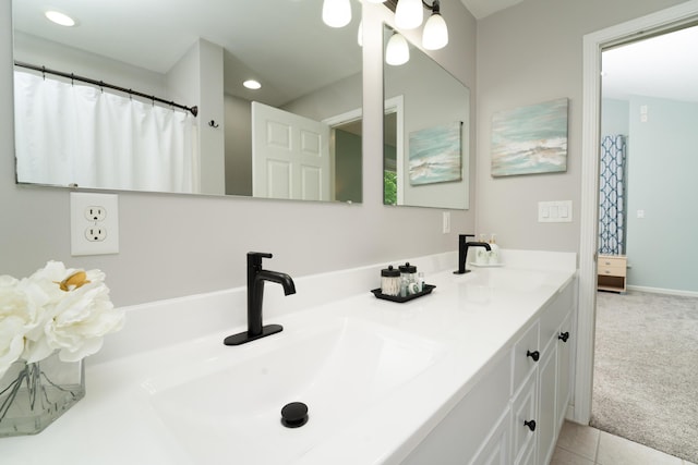 bathroom with vanity and tile patterned flooring