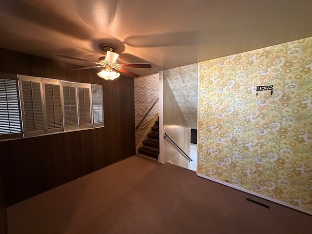 carpeted empty room with ceiling fan