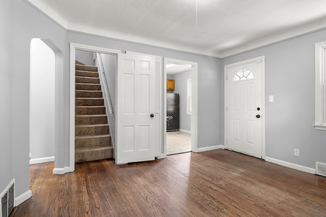 foyer featuring dark wood-type flooring