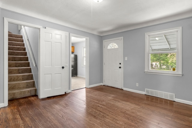 foyer entrance featuring dark hardwood / wood-style floors