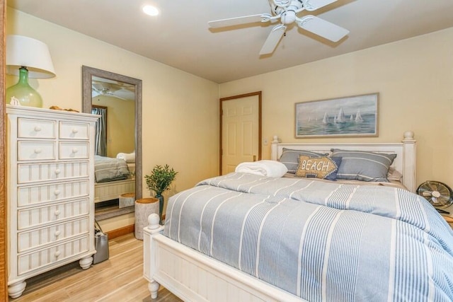 bedroom with ceiling fan and light hardwood / wood-style flooring