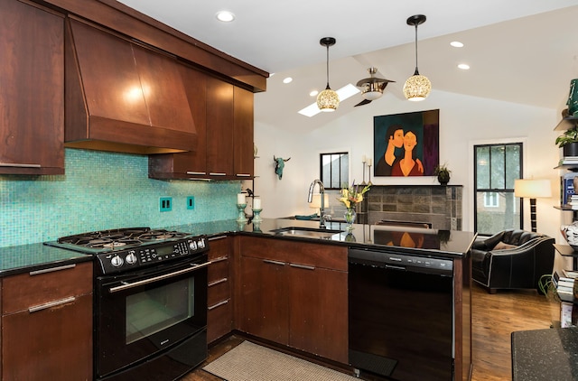 kitchen featuring premium range hood, sink, vaulted ceiling, kitchen peninsula, and black appliances