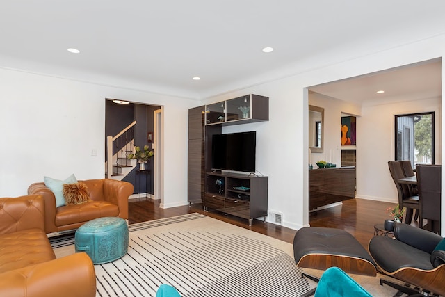 living room with dark hardwood / wood-style floors