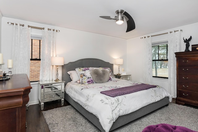 bedroom featuring dark hardwood / wood-style floors and ceiling fan