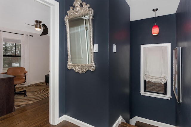 corridor featuring dark wood-type flooring