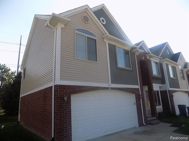 view of side of property featuring a garage