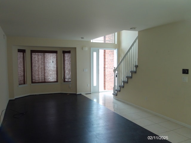 entryway with light tile patterned floors