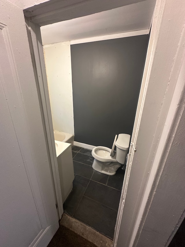 bathroom with tile patterned flooring and toilet