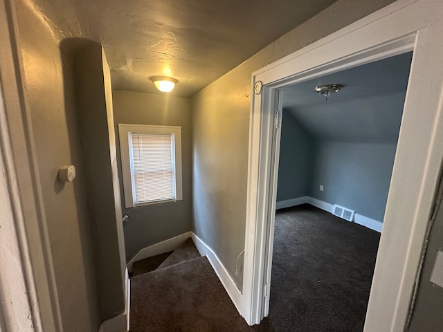 hallway with carpet floors