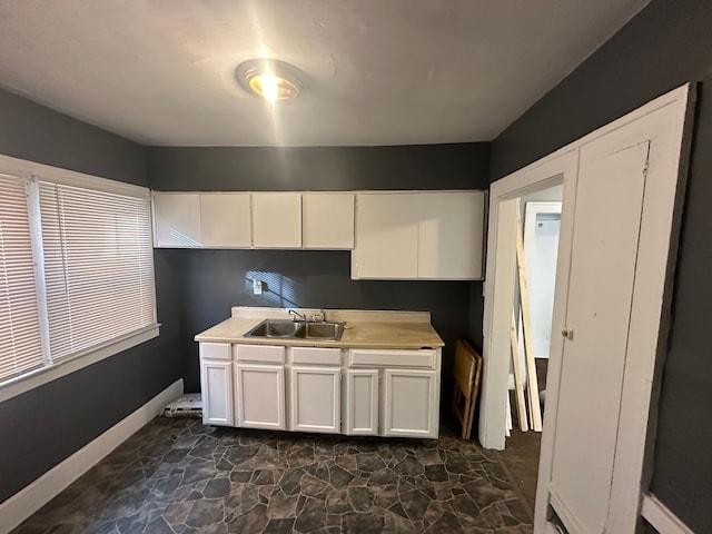 kitchen with sink and white cabinets