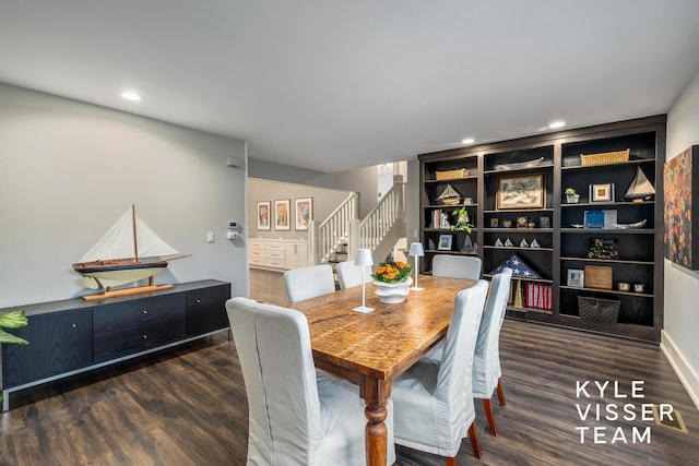 dining room with dark hardwood / wood-style flooring