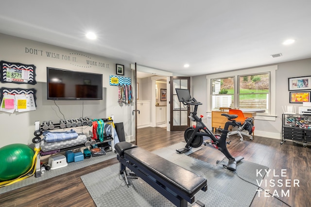 workout room with hardwood / wood-style floors