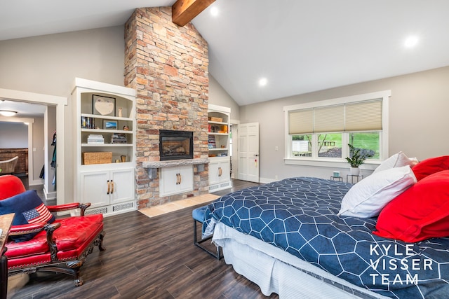 bedroom with beam ceiling, a stone fireplace, high vaulted ceiling, and dark hardwood / wood-style floors