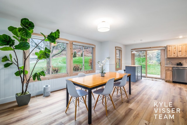 dining area featuring light wood-type flooring