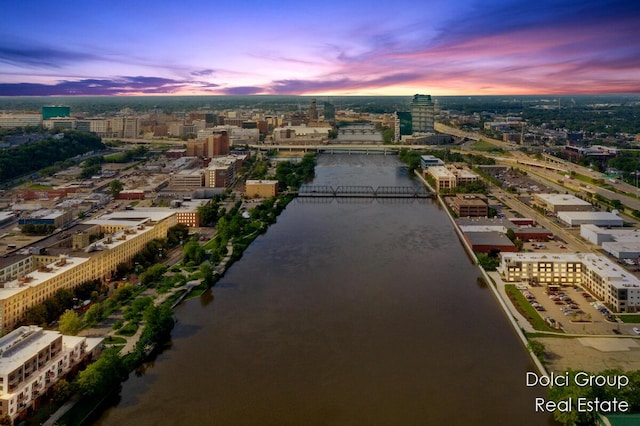 aerial view at dusk with a water view