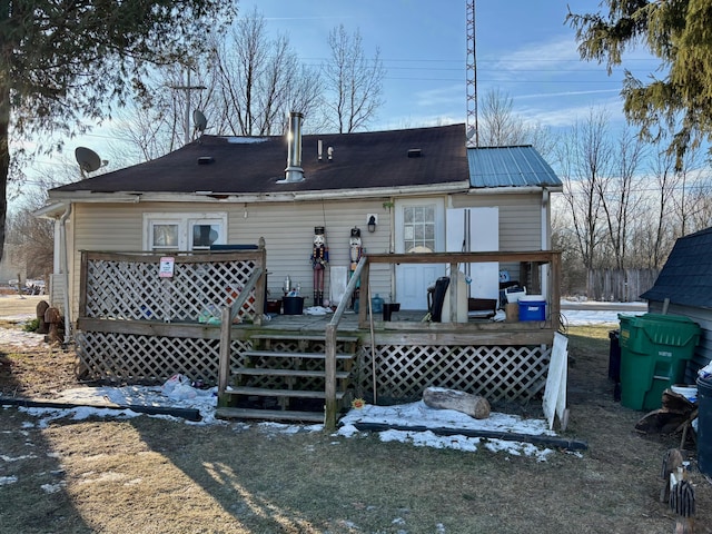 back of house featuring a wooden deck