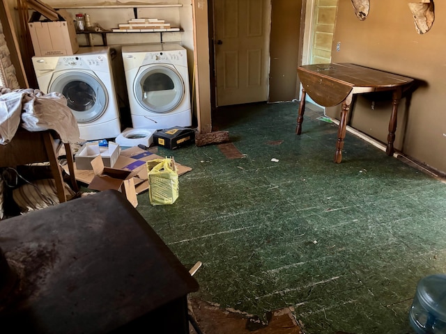 clothes washing area with washer and clothes dryer