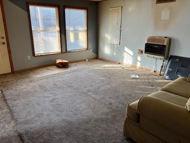 carpeted living room featuring heating unit