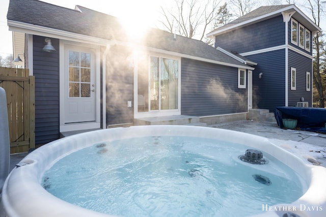 exterior space featuring a hot tub