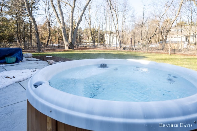 view of pool with a hot tub