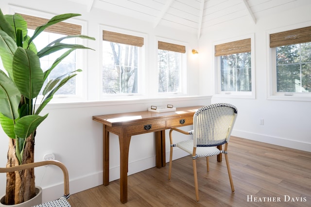 office featuring hardwood / wood-style flooring and lofted ceiling with beams