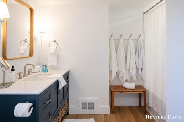 bathroom featuring vanity and wood-type flooring