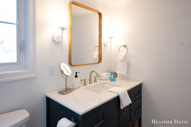 bathroom with vanity and toilet