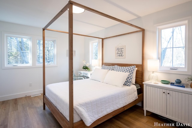 bedroom with hardwood / wood-style floors