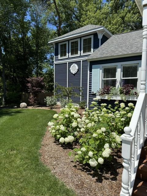 view of outbuilding with a yard