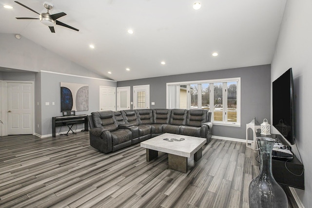 living room featuring high vaulted ceiling, hardwood / wood-style floors, and ceiling fan