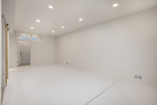 empty room featuring a barn door