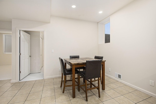 dining space with light tile patterned flooring