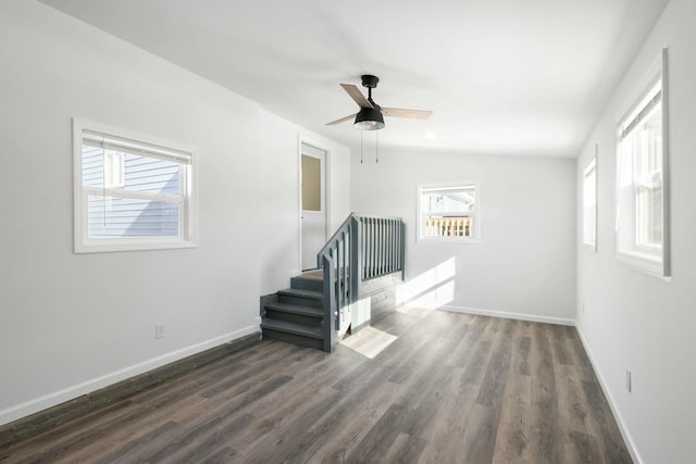 interior space featuring dark hardwood / wood-style flooring and ceiling fan