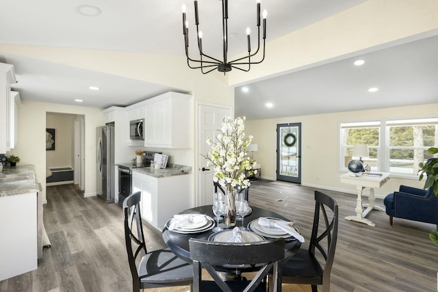 dining space with hardwood / wood-style floors